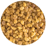 A circular close-up of small irregular yellow and tan granules of Frankincense Boswelia carterii filling the frame, shown on a white background.