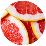 Close-up circular photo of sliced red grapefruit with bright pink-red pulp and pale rind, isolated on a white background.